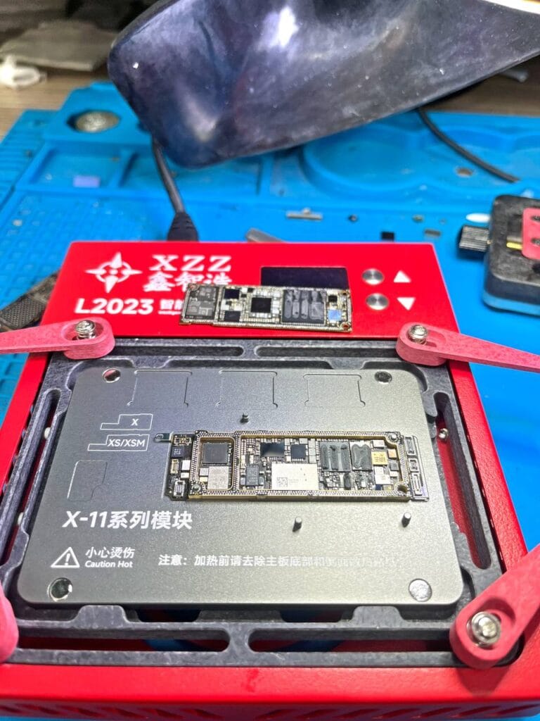 Motherboard is taken apart for iPhone motherboard repair